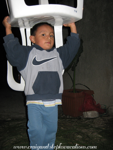 Eddy helps to carry chairs