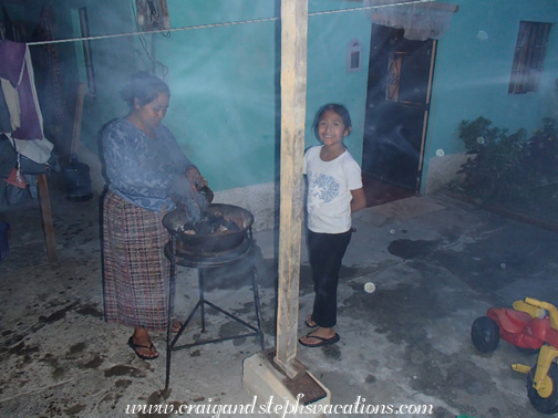 Paulina lighting the grill with Yoselin