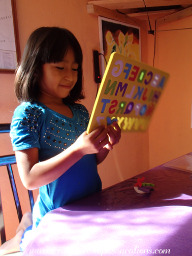 Aracely with the alphabet puzzle