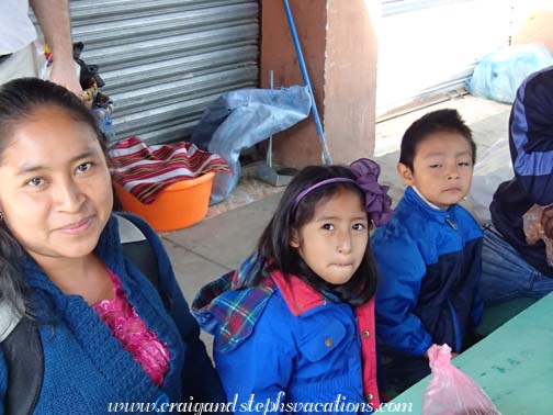 Paulina, Aracely, and Eddy having breakfast at the market