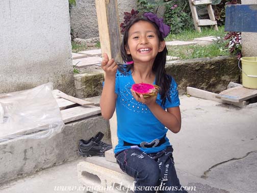 Aracely eats a pitaya