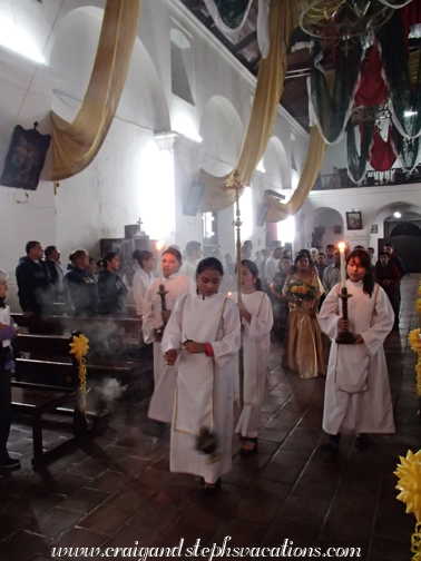 Paola and her parents and godparents walk in the opening processional