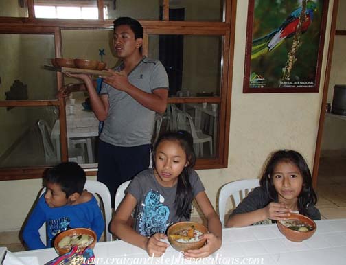 Junior serves the kids lunch