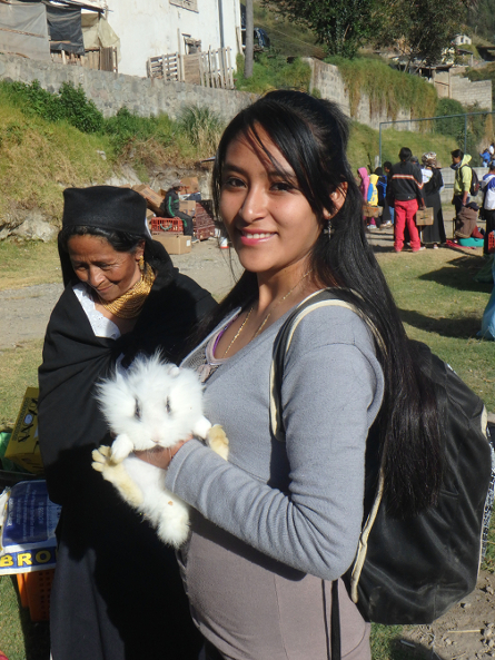 Vanesa with a fluffy bunny at the Otavalo Animal Market