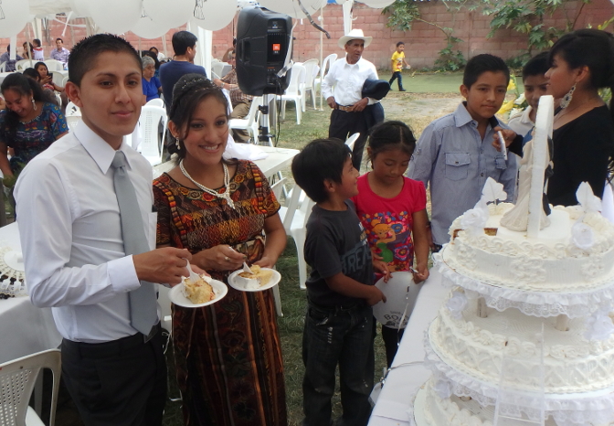 Alex and Abigail with wedding cake