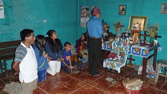 Ajq'ij Marcelo Alonso Felipe performs a Mayan cleansing ceremony