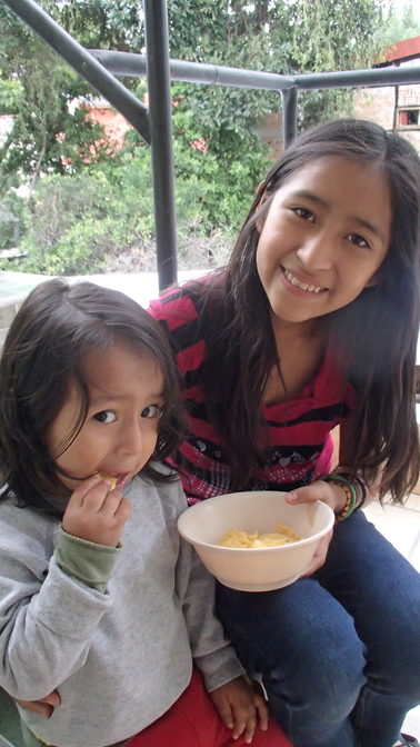 Ian and Aracely enjoying Ecuadorian Doritos