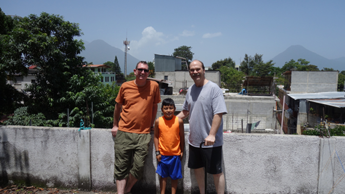 Tyson, Eddy, and Craig take in views from the roof deck