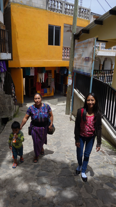 Ian Ivan, Paulina, and Aracely wander through the steep narrow alleyways of San Antonio Palopo