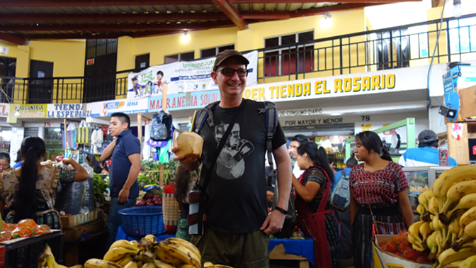 Tyson enjoys coconut water at the Panajachel market