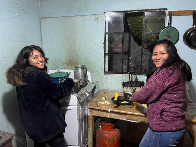 Paola and Yoselin make dinner for us