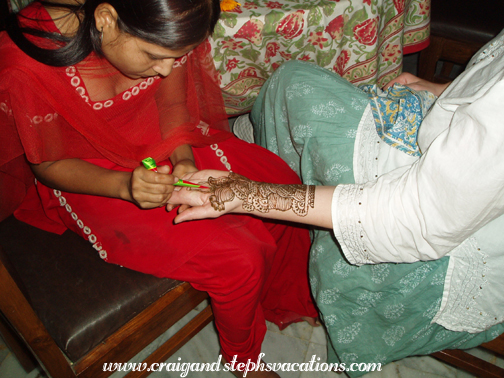 Steph's hand is decorated with henna