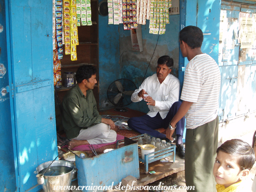 Rajendra taking tea at a food stall in Fatehpur