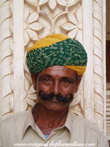 Flute player with a curly moustache