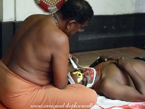 Rice paste is used to secure a Kathakali performer's prosthetic make-up