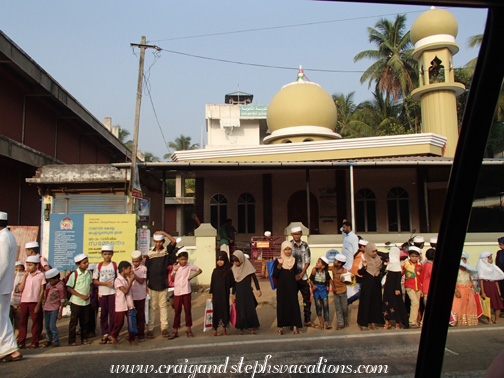 Muslim children waiting for the bus to Koranic school