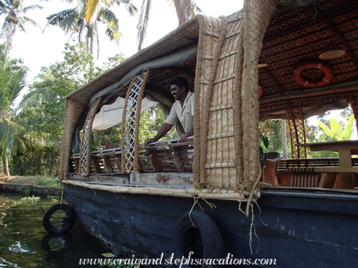 William watches as we pull away from the houseboat in a motorized canoe