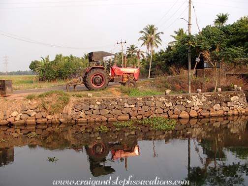 Tractor reflected in the canal