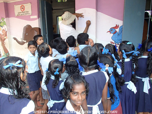 Mukul draws for the schoolchildren of Moncompu