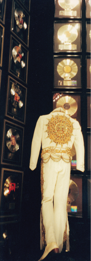 Elvis' jumpsuit and gold records on display in his racquetball court