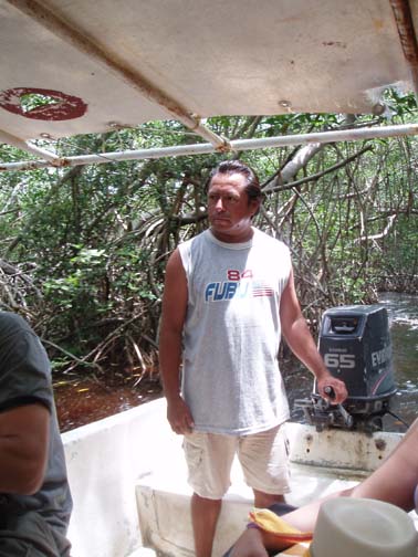 Jose guiding the boat through mangroves