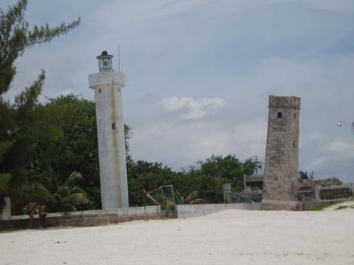 Lighthouse and tower on the Celestun beach