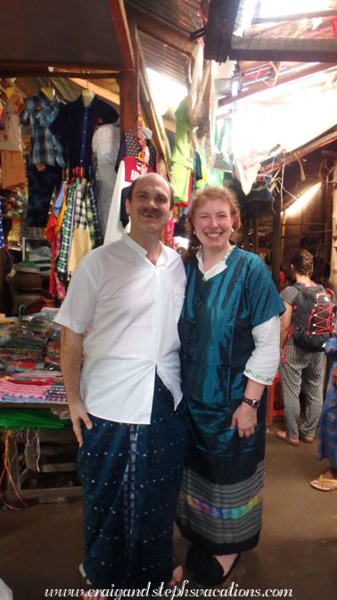 Trying on our new traditional Burmese outfits at the Menisithu Market