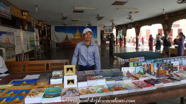 Seller from whom we purchased a graphic novel in Burmese depicting the founding of Shwezigon Pagoda