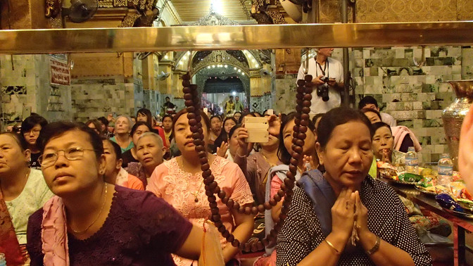 The devoted faithful who have come to watch the washing of Mahamuni Buddha