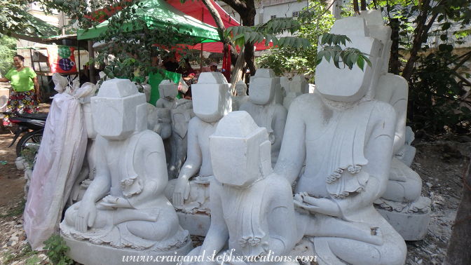 Marble Buddhas await their faces