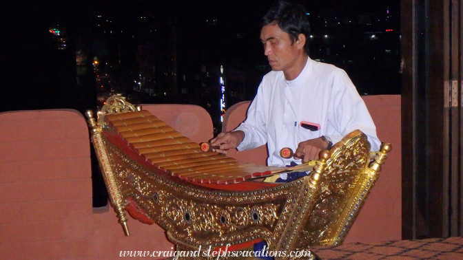 Man plays a pattala (Burmese bamboo xylophone) at Shwe Bagan Restaurant