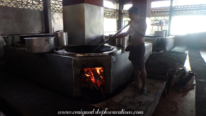 Volunteers prepare food for the monks at Mahagandayon Monastery