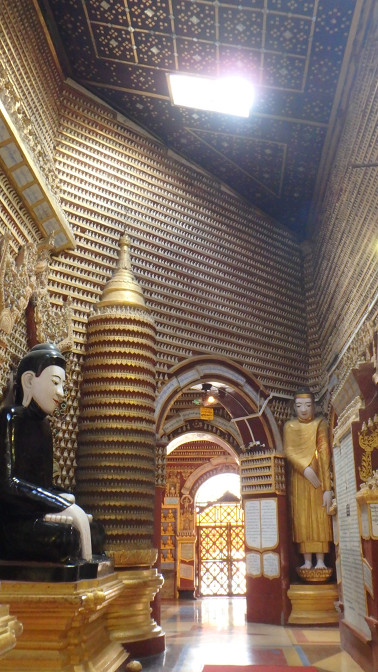 Every surface in Thanboddhay Pagoda is lined with tiny white Buddhas