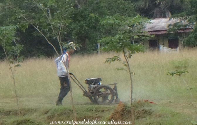 Local lawnmower at the Maw Laik Golf Club