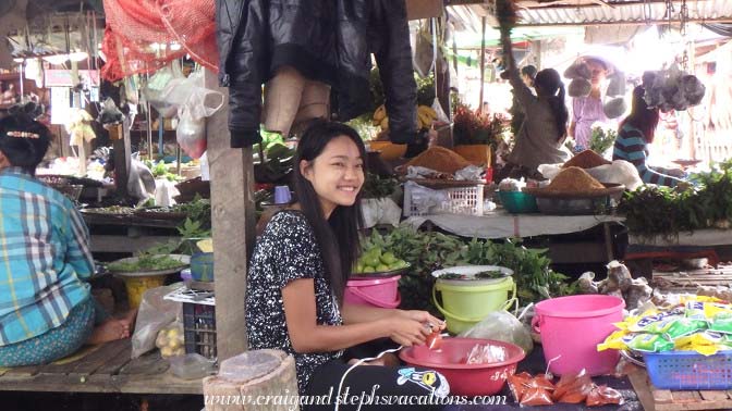 Young woman selling food at the market