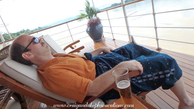 Craig relaxes with a beer on the boat