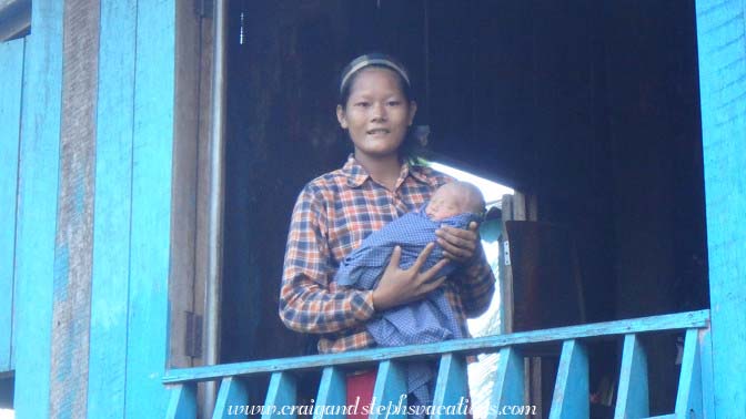 Woman brings her 7-day-old baby to show us, Tha Phan Seit Village