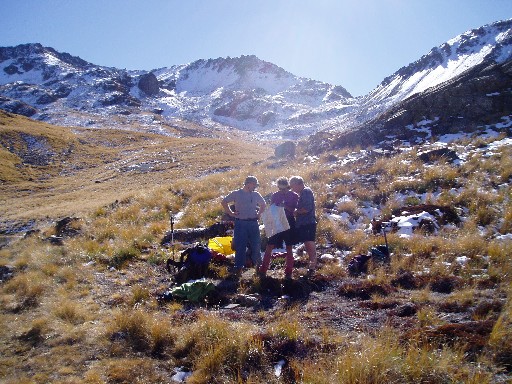 Craig and Stan consulting with David at the tarn