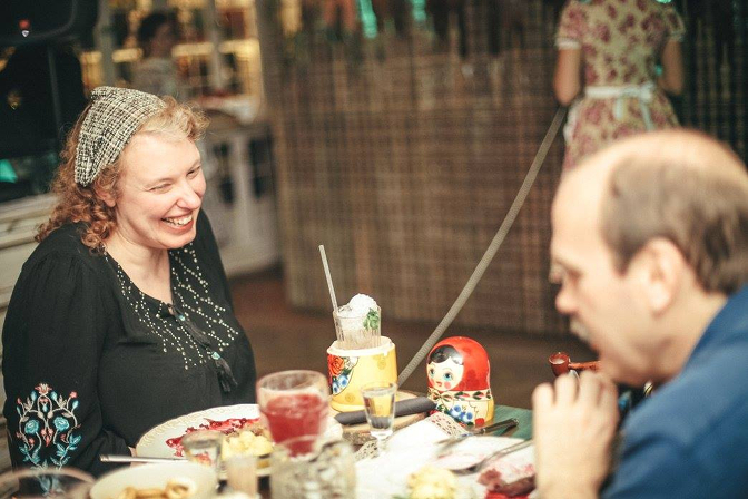 Enjoying a cocktail served in a matryoshka (photo courtesy of Katyusha)