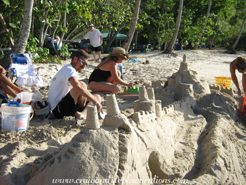 Marty and Jesi work on the sand castle