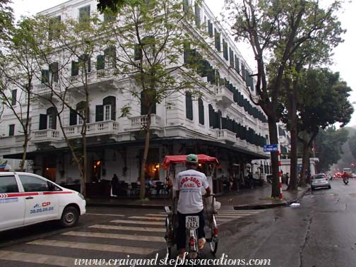 Arriving at the Metropole Hotel by cyclo