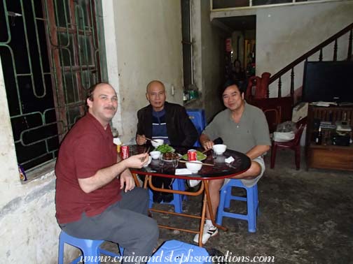 Craig, Mr. Giang, and Cuong at dinner at Nha Hang Tien Nhi restaurant